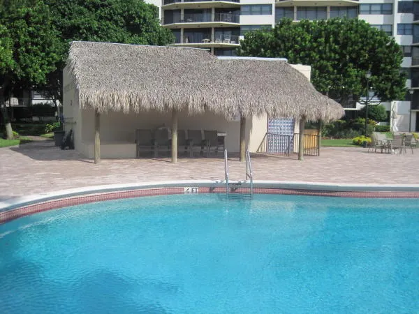 a view of a house with a yard and tree