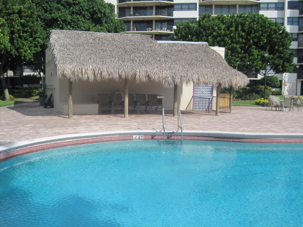859 Jeffery Street, Unit 208 Boca Raton, FL 33487 - Photo 5 of 39 a view of a house with a yard and tree