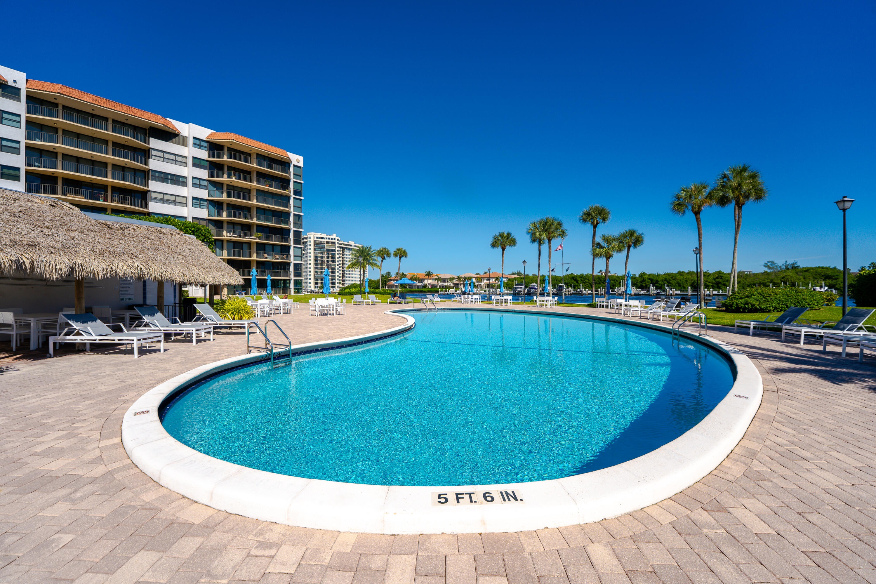 859 Jeffery Street, Unit 208 Boca Raton, FL 33487 - Photo 6 of 39 a view of a swimming pool with outdoor seating
