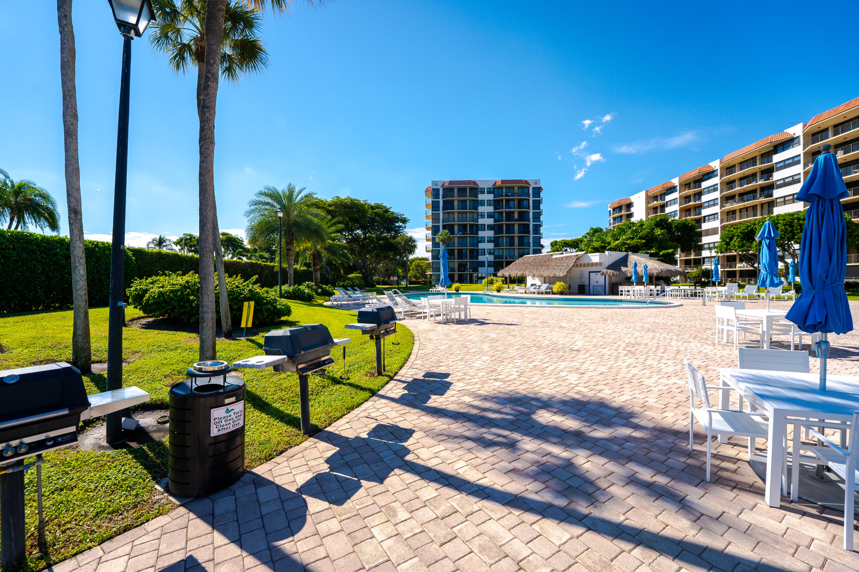 859 Jeffery Street, Unit 208 Boca Raton, FL 33487 - Photo 8 of 39 a view of a swimming pool with a patio