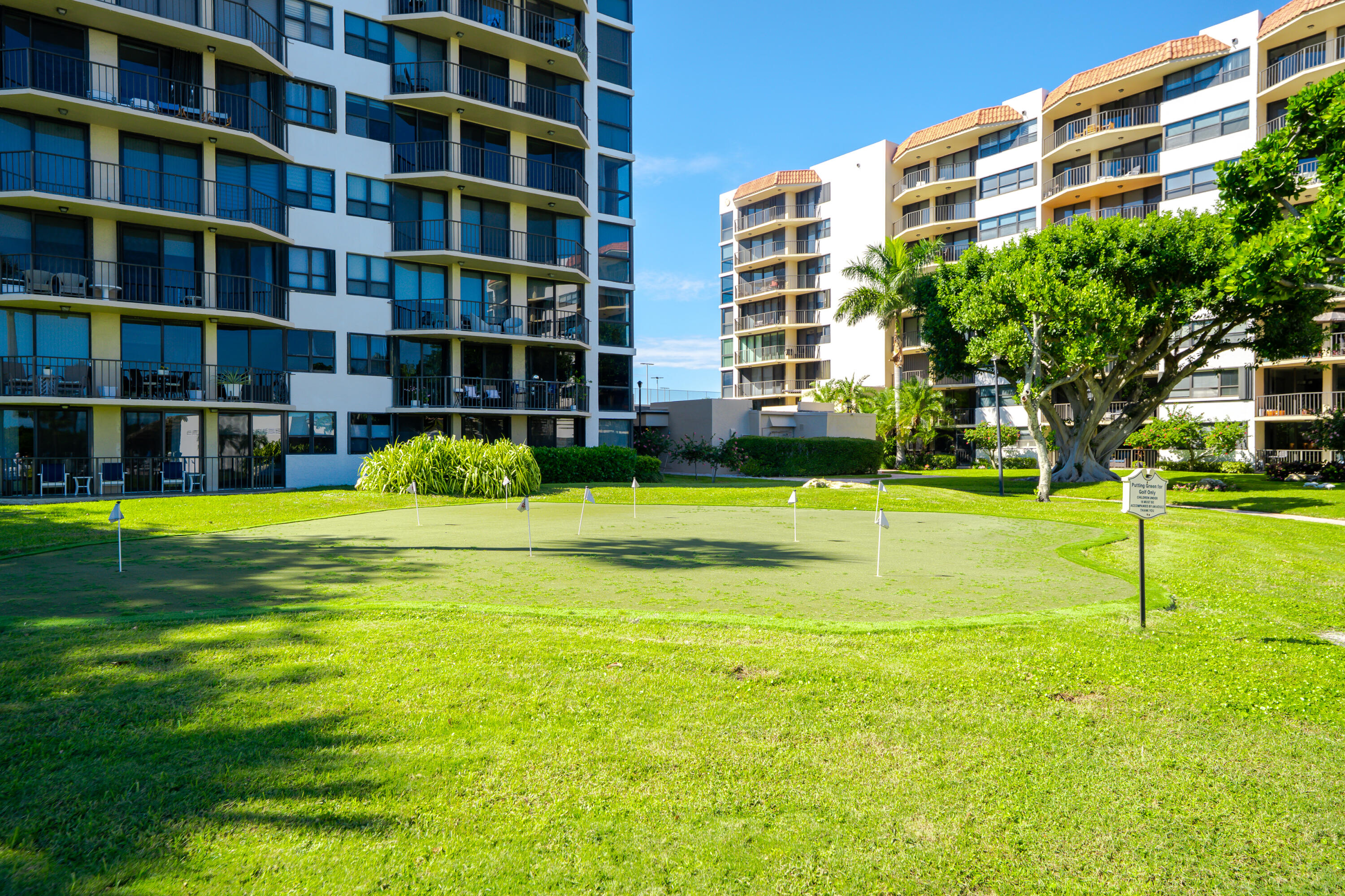 859 Jeffery Street, Unit 208 Boca Raton, FL 33487 - Photo 10 of 39 a view of swimming pool with outdoor seating and house in the background
