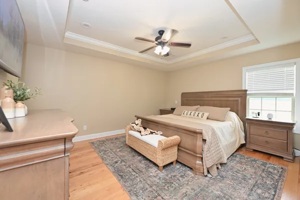 a bedroom with a bed and window