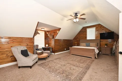 a spacious bathroom with a double vanity sink and a mirror