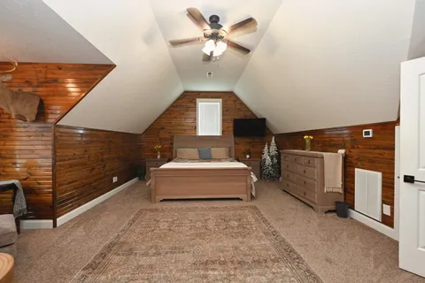 a bedroom with bed and window