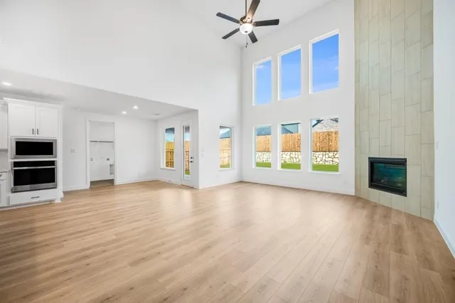 a bathroom with a double vanity sink mirror and window