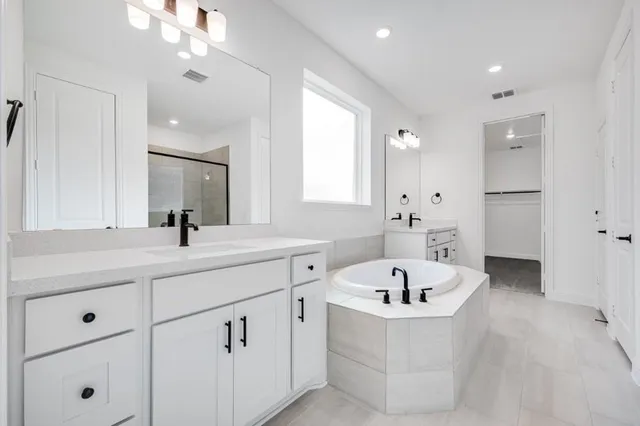 a bathroom with a sink toilet a mirror and shower