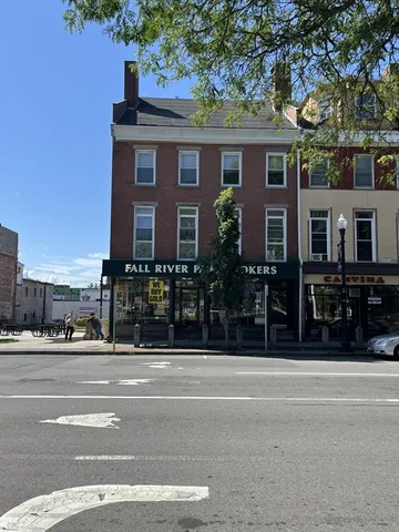 a front view of a house with a porch
