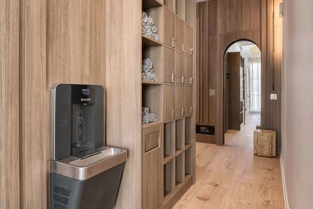 a hallway with sliding door and bedroom