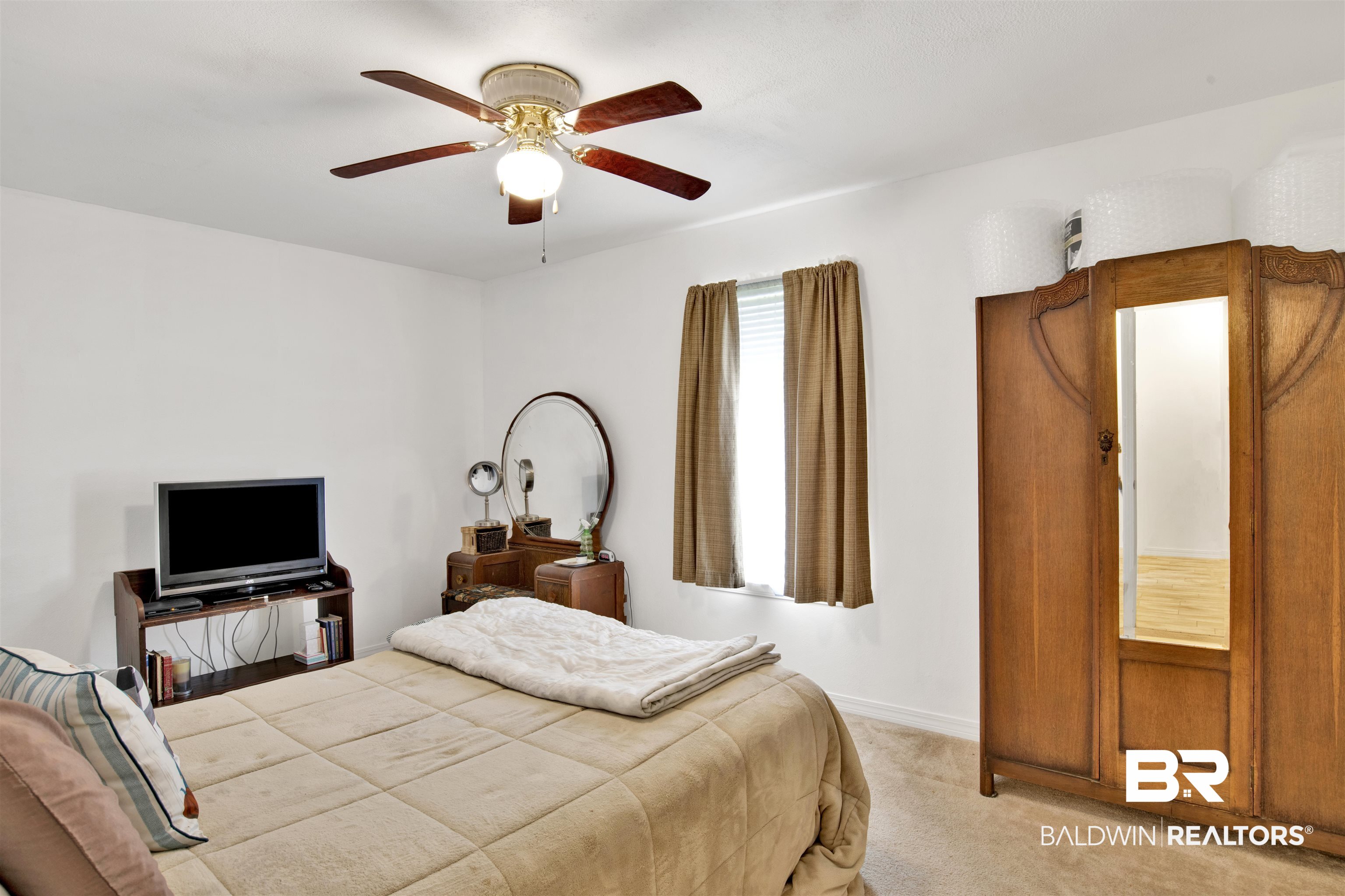 54563 Splinter Hill Road Perdido, AL 36562 - Photo 25 of 29 Bedroom with light carpet and ceiling fan