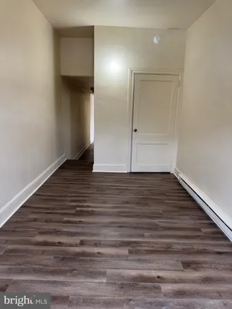a view of wooden floor in an empty room