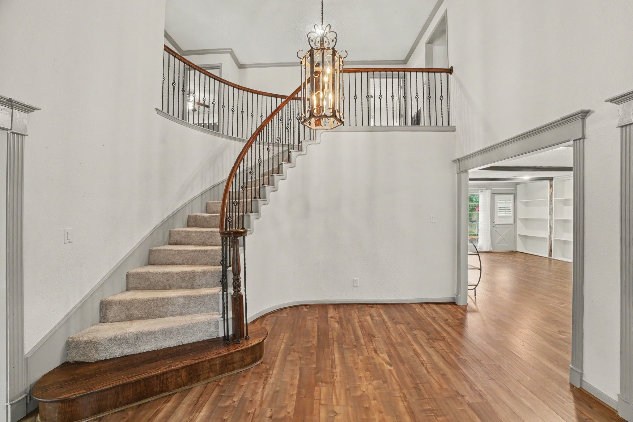 9530 Arcade Drive Spring, TX 77379 - Photo 5 of 32 Grand entry welcomes you with an elegant spiral staircase, creating a stunning first impression.