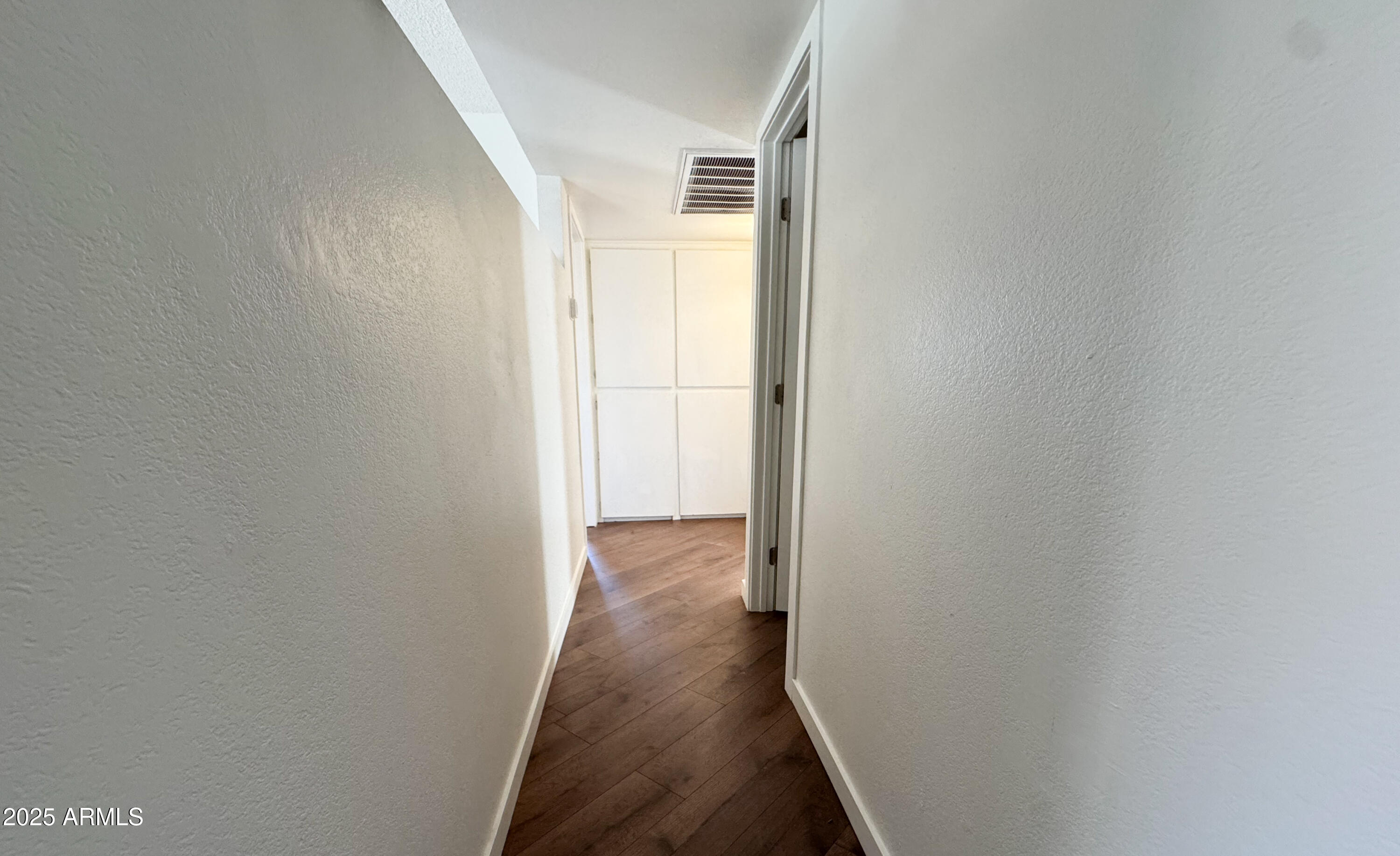 10215 North 8th Avenue, Unit 1 Phoenix, AZ 85021 - Photo 12 of 21 a view of a hallway with wooden floor