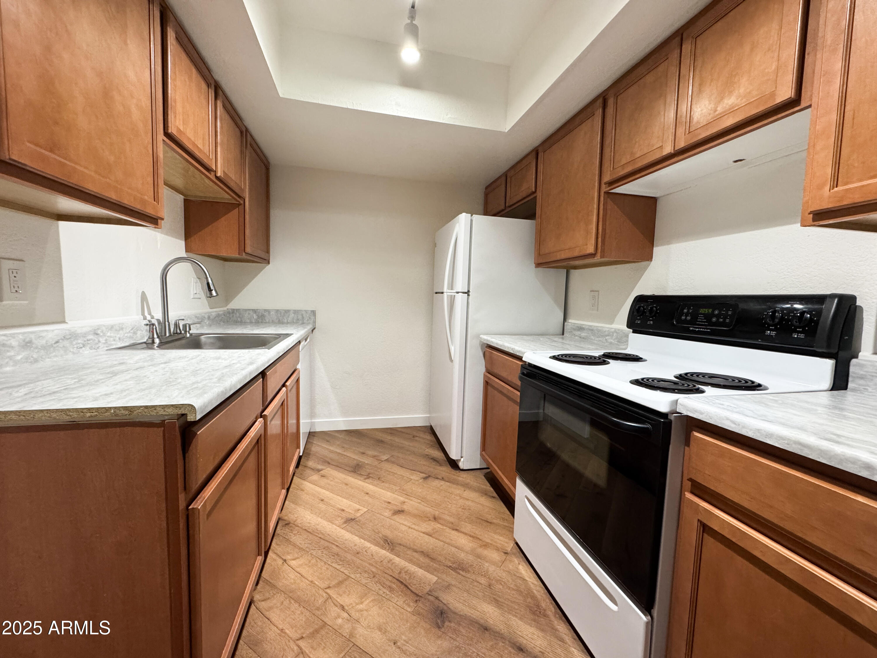 10215 North 8th Avenue, Unit 1 Phoenix, AZ 85021 - Photo 14 of 21 a kitchen with a sink stove and refrigerator