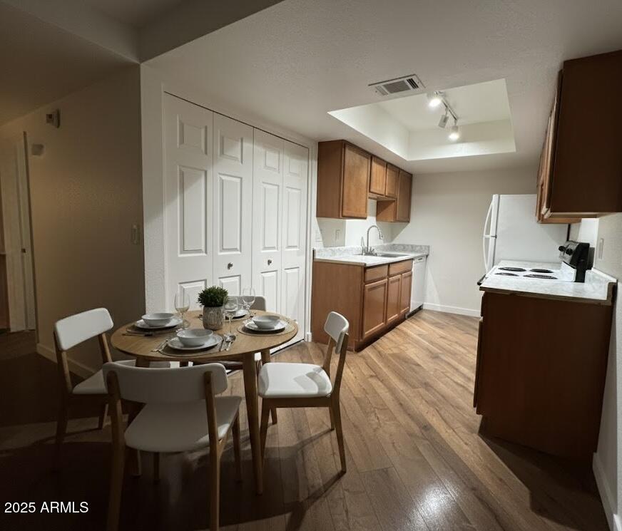 10215 North 8th Avenue, Unit 1 Phoenix, AZ 85021 - Photo 4 of 21 a view of a dining room with furniture and wooden floor