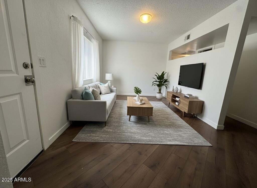 10215 North 8th Avenue, Unit 1 Phoenix, AZ 85021 - Photo 5 of 21 a living room with furniture and a flat screen tv