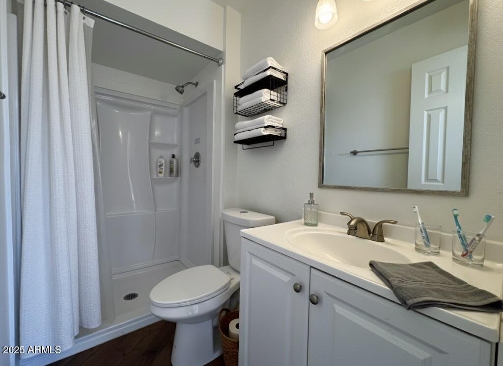 10215 North 8th Avenue, Unit 1 Phoenix, AZ 85021 - Photo 6 of 21 a bathroom with a sink a toilet and shower