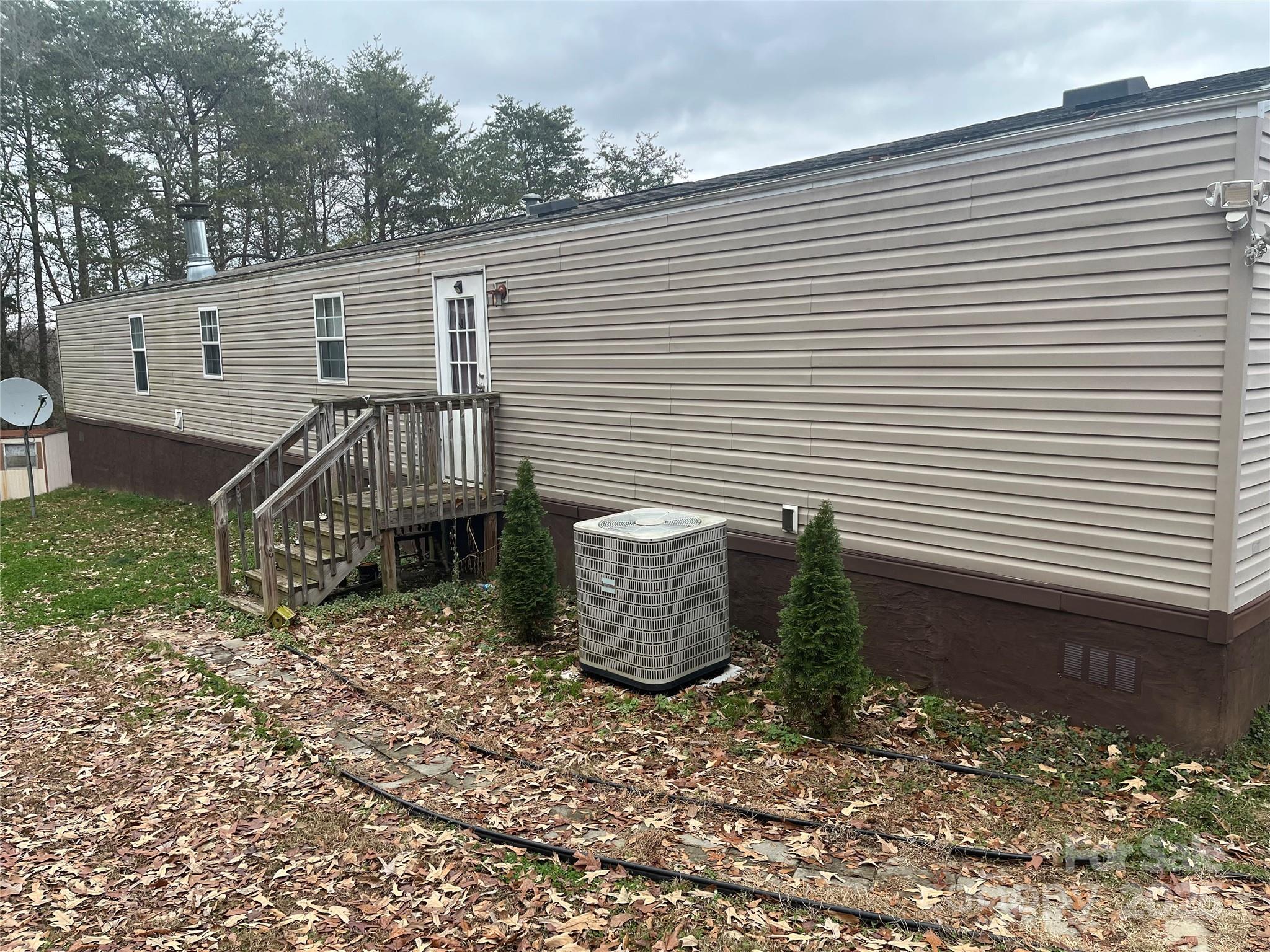 223 Green Acres Road Mooresboro, NC 28114 - Photo 2 of 14 a view of a patio with a table and chairs