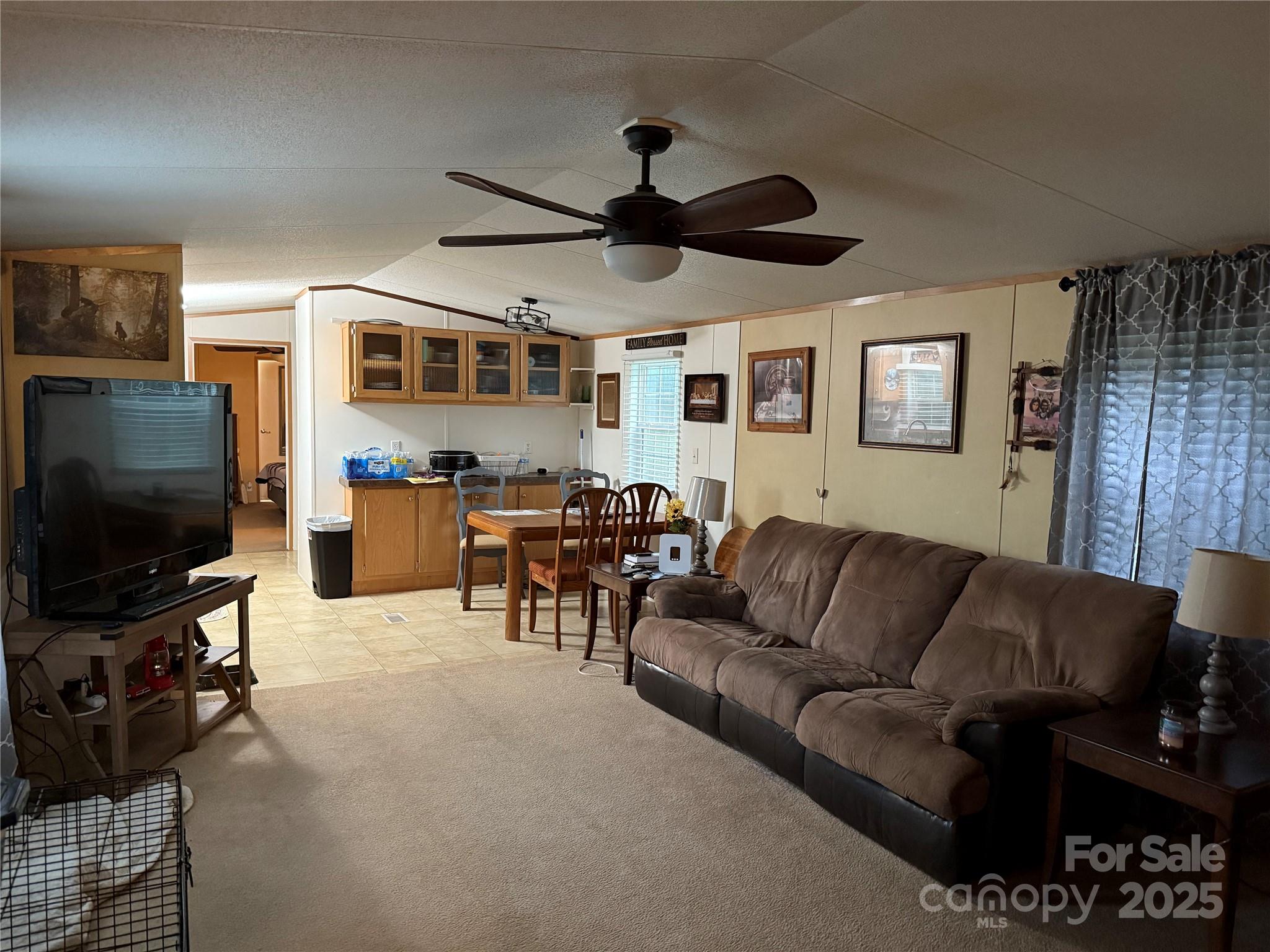 223 Green Acres Road Mooresboro, NC 28114 - Photo 4 of 14 a living room with furniture and a flat screen tv