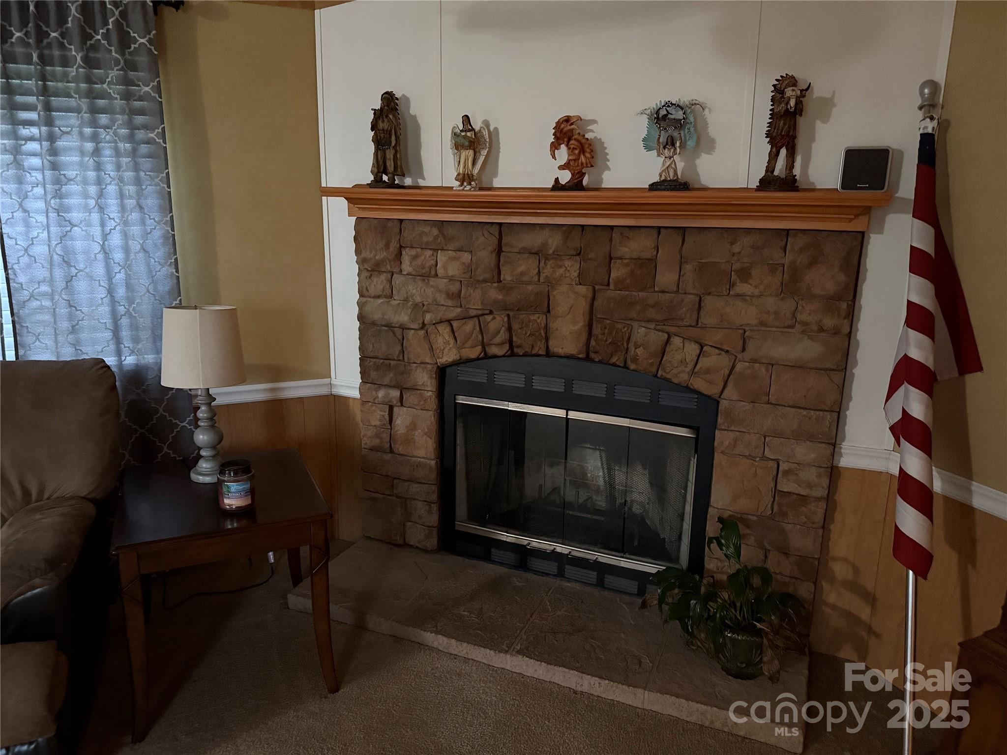 223 Green Acres Road Mooresboro, NC 28114 - Photo 6 of 14 a living room with furniture and a fireplace