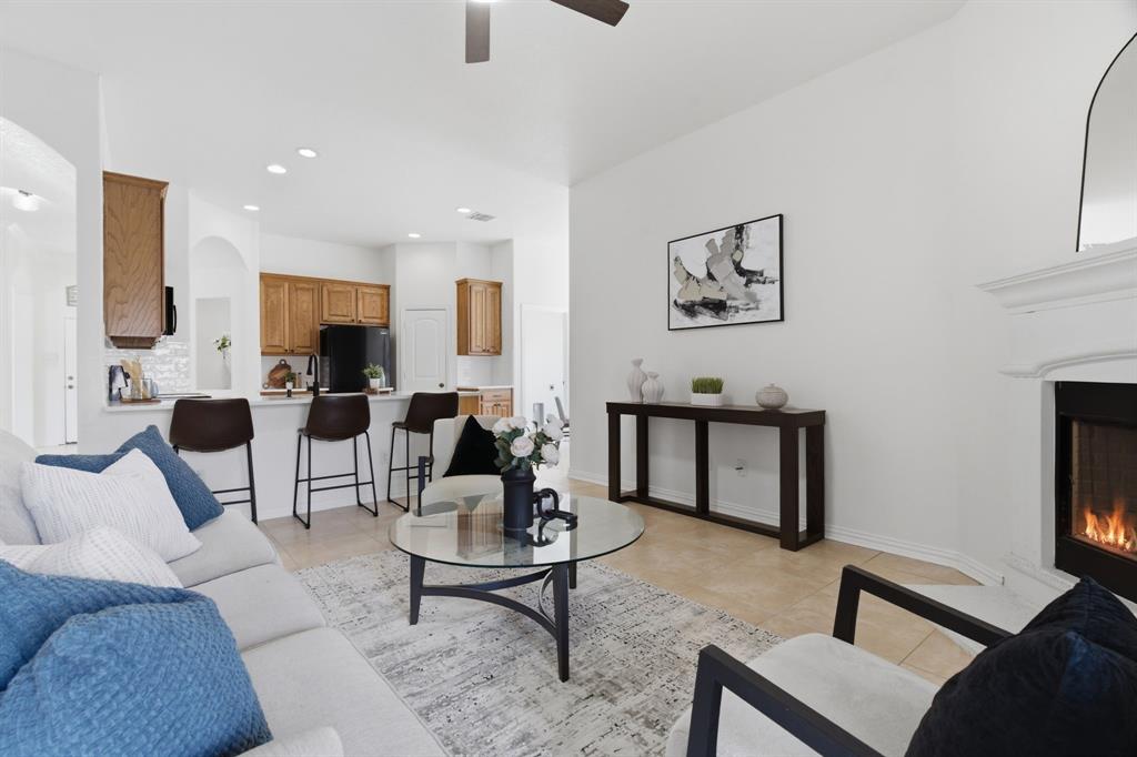 813 Chase Circle Hurst, TX 76053 - Photo 12 of 40 a living room with furniture and a flat screen tv