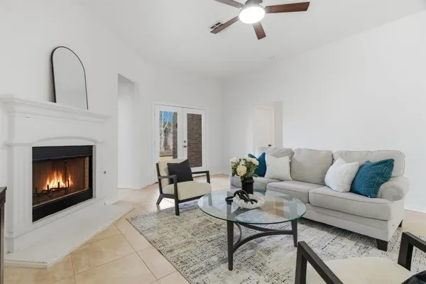a living room with furniture and a fireplace