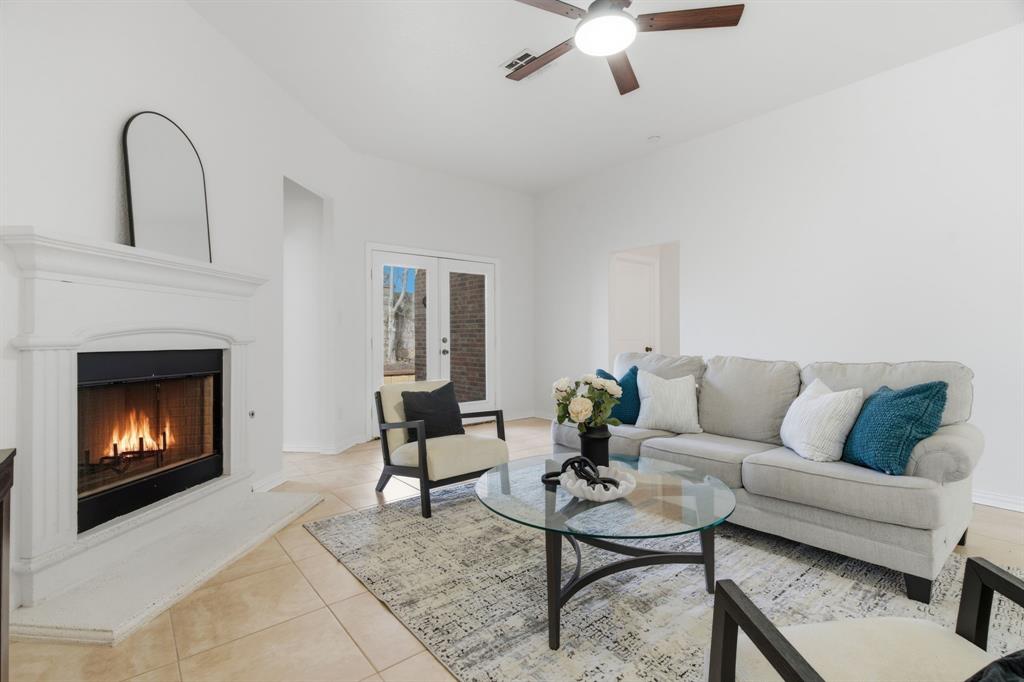 813 Chase Circle Hurst, TX 76053 - Photo 13 of 40 a living room with furniture and a fireplace