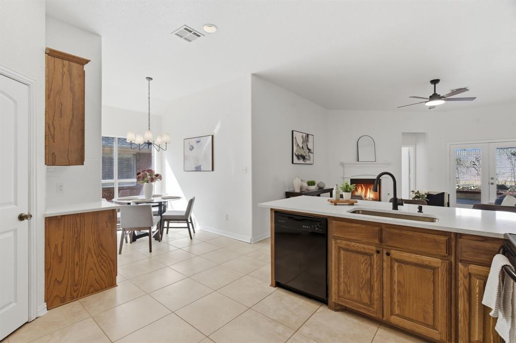 813 Chase Circle Hurst, TX 76053 - Photo 16 of 40 a view of kitchen with sink dining table and chairs