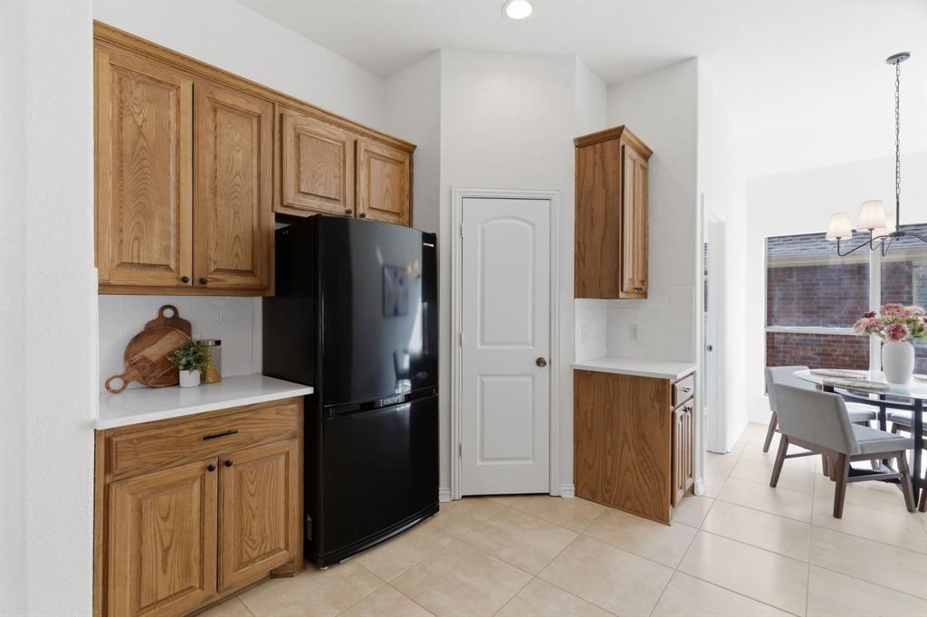 813 Chase Circle Hurst, TX 76053 - Photo 19 of 40 a kitchen with stainless steel appliances granite countertop a refrigerator and a stove top oven