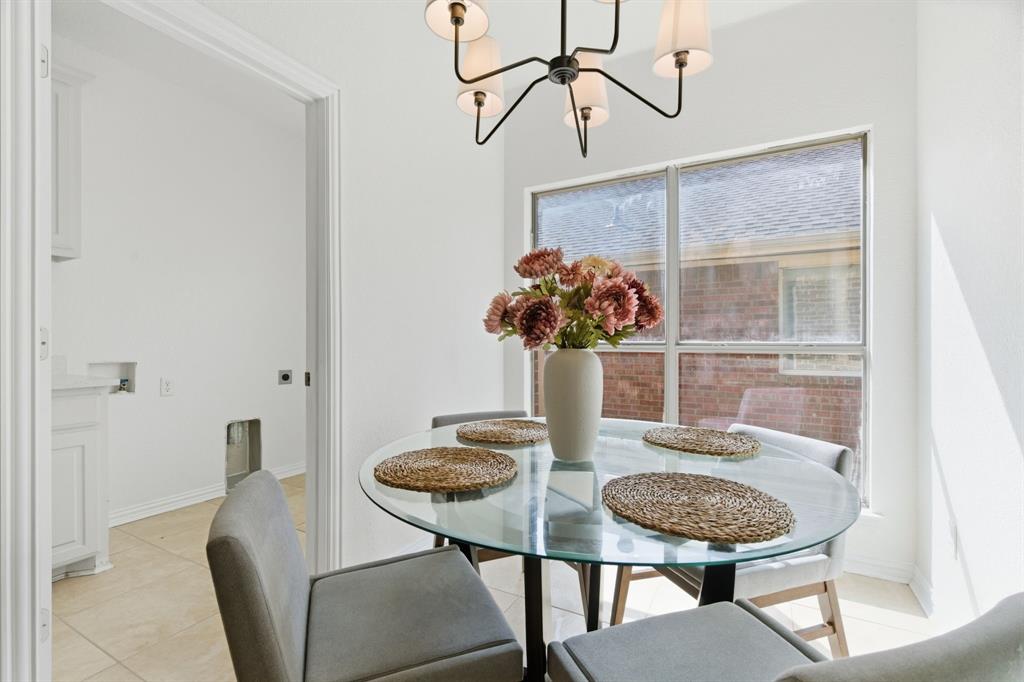 813 Chase Circle Hurst, TX 76053 - Photo 22 of 40 a view of a dining room with furniture and wooden floor
