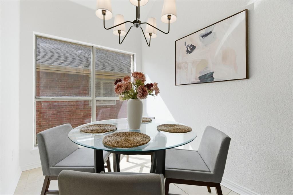 813 Chase Circle Hurst, TX 76053 - Photo 23 of 40 a view of a dining room with furniture and wooden floor