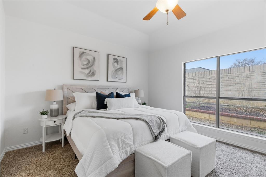 813 Chase Circle Hurst, TX 76053 - Photo 25 of 40 a bedroom with a bed and a large window
