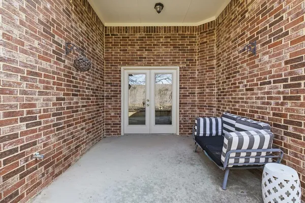a view of a balcony with furniture