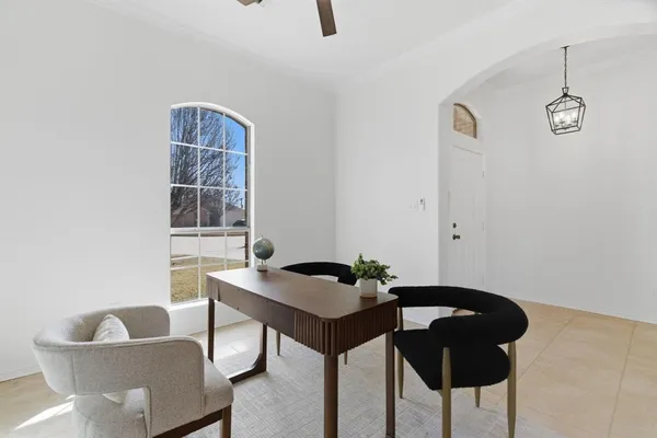 a dining room with furniture and window