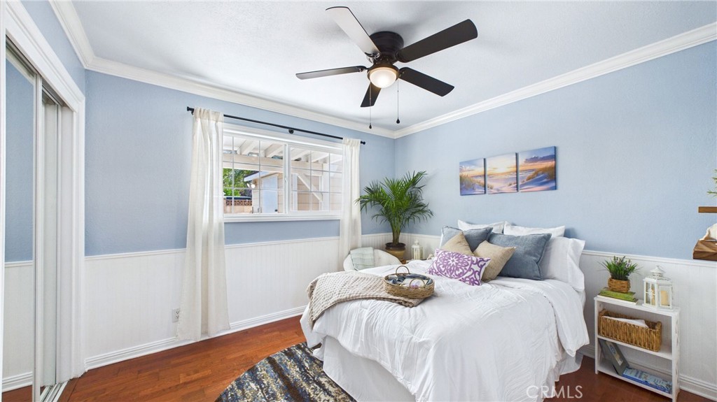 21104 Rosedell Drive Saugus, CA 91350 - Photo 21 of 33 Coastal-inspired bedroom with mirrored closet doors and natural light to brighten this thoughtfully designed space