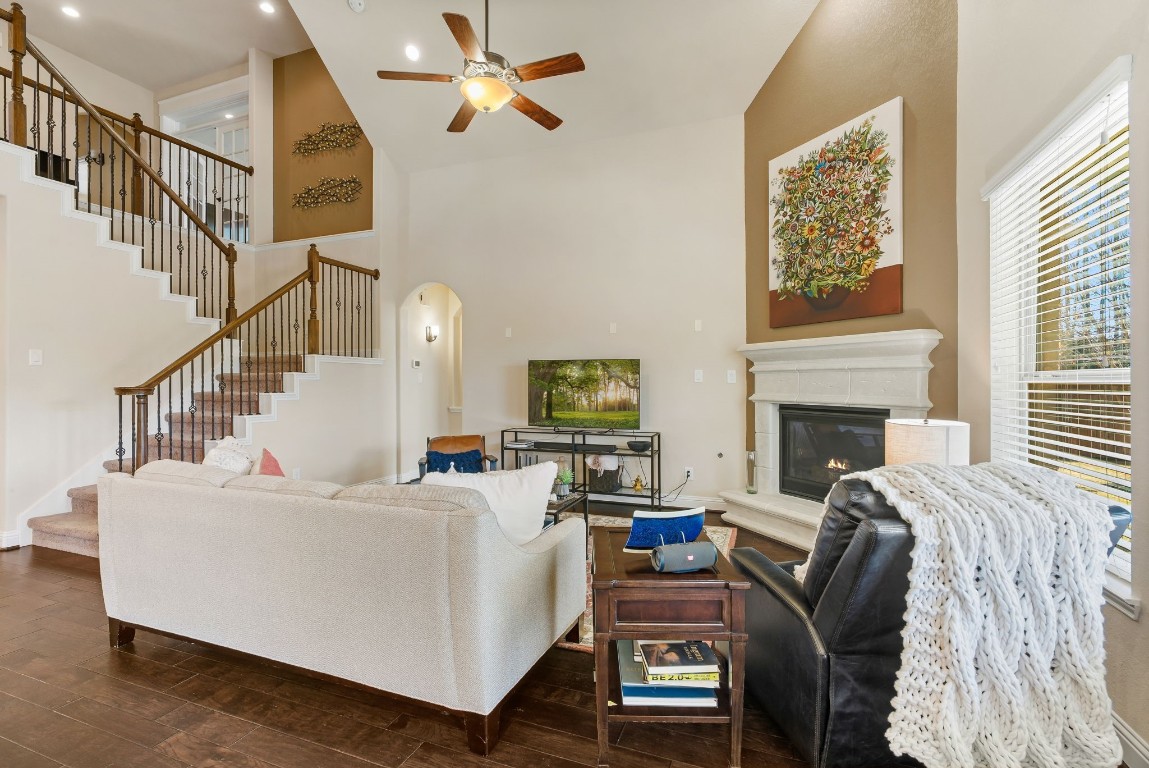 10 Waterfall Way The Woodlands, TX 77375 - Photo 13 of 45 a living room with furniture and a fireplace