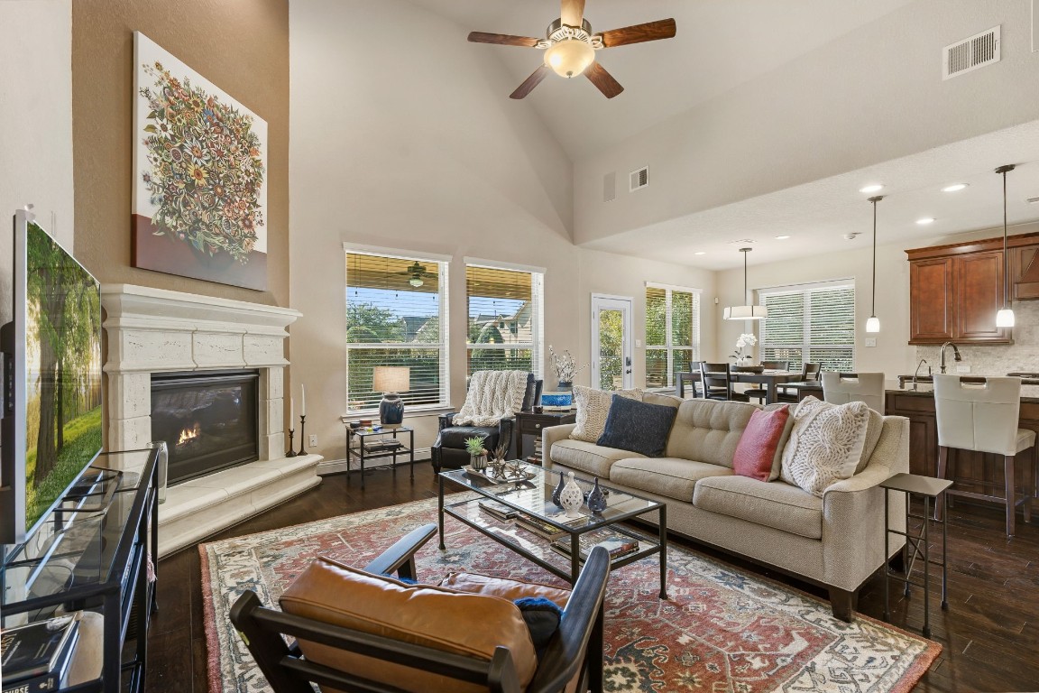10 Waterfall Way The Woodlands, TX 77375 - Photo 15 of 45 a living room with furniture fireplace and a flat screen tv