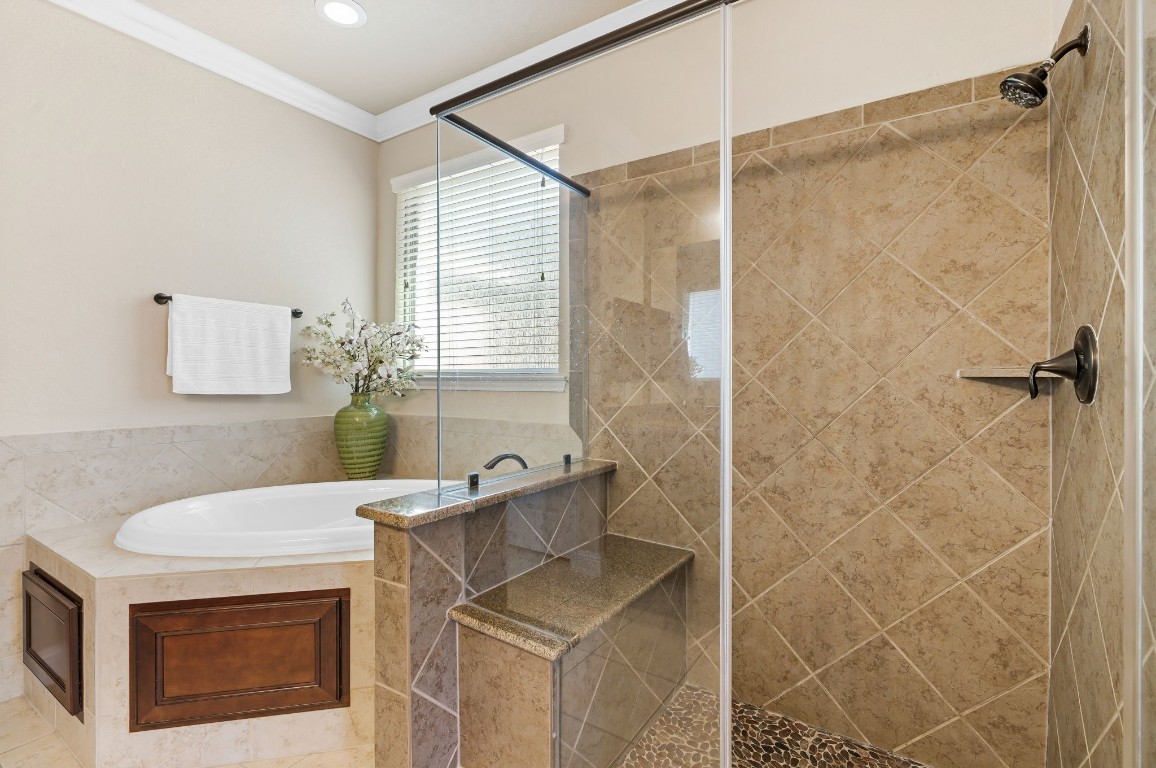10 Waterfall Way The Woodlands, TX 77375 - Photo 25 of 45 a bathroom with a granite countertop sink a mirror and shower
