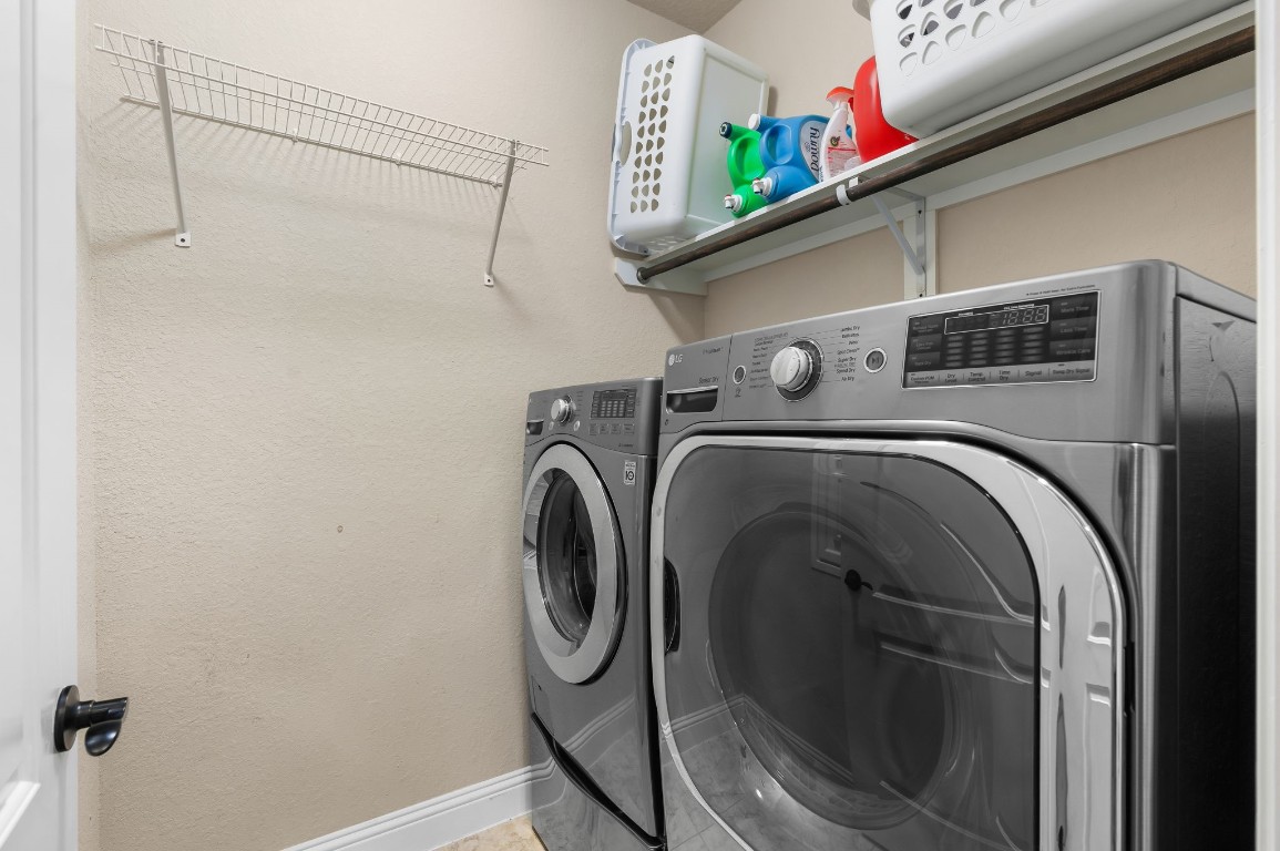 10 Waterfall Way The Woodlands, TX 77375 - Photo 28 of 45 a utility room with dryer and washer