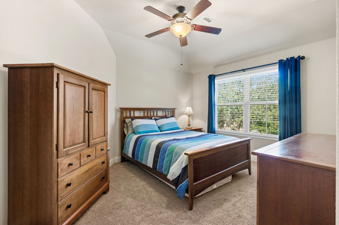 10 Waterfall Way The Woodlands, TX 77375 - Photo 34 of 45 a bed sitting in a bedroom next to a window