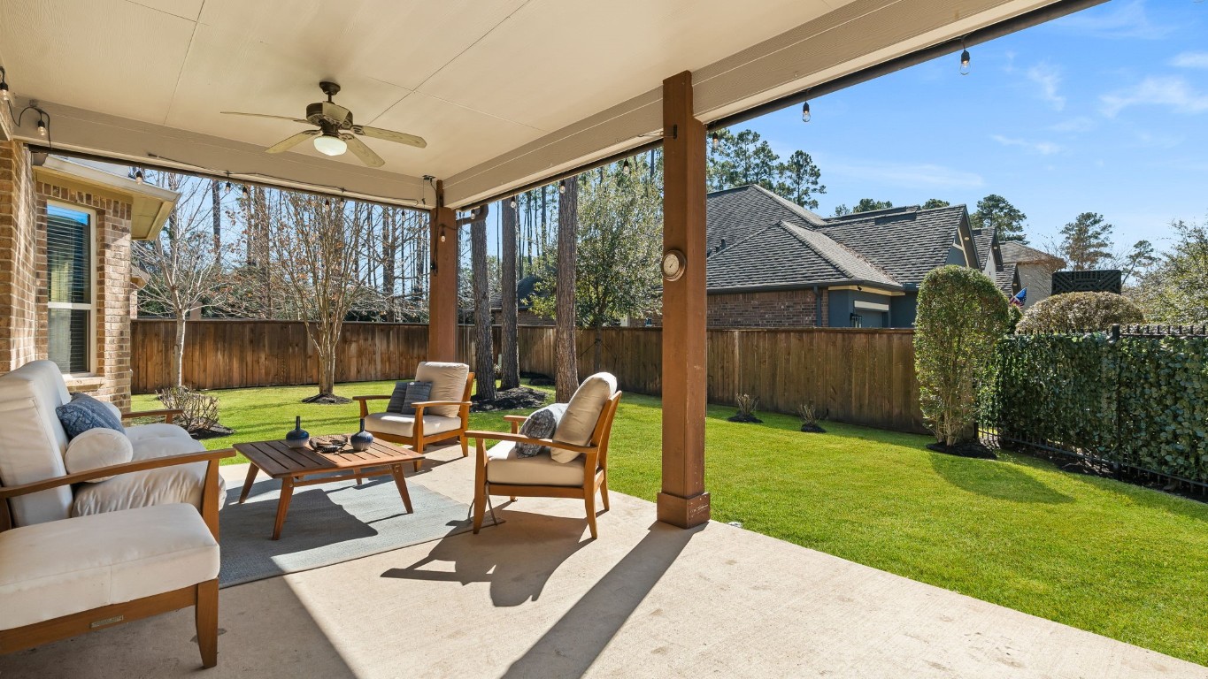 10 Waterfall Way The Woodlands, TX 77375 - Photo 39 of 45 a outdoor space with patio the couches and a dining table with garden view
