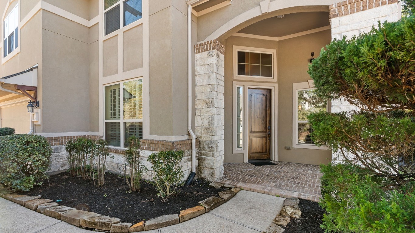 10 Waterfall Way The Woodlands, TX 77375 - Photo 5 of 45 a front view of a house with a yard