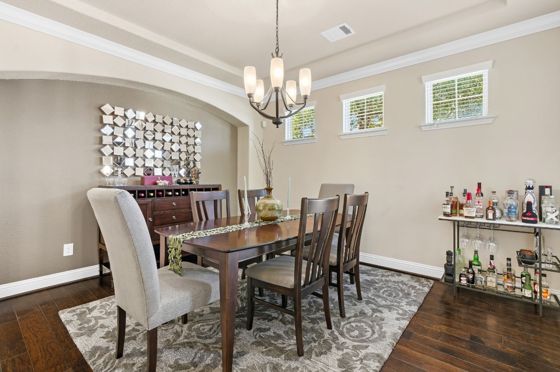10 Waterfall Way The Woodlands, TX 77375 - Photo 7 of 45 a view of a dining room with furniture window and wooden floor