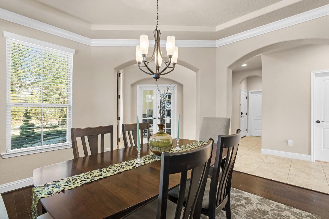 10 Waterfall Way The Woodlands, TX 77375 - Photo 8 of 45 a view of a dining room with furniture window and wooden floor