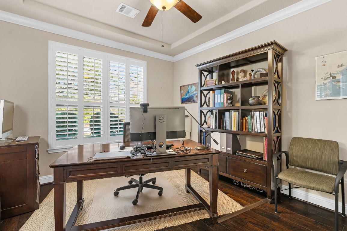 10 Waterfall Way The Woodlands, TX 77375 - Photo 9 of 45 a view of a workspace with furniture and a bookshelf