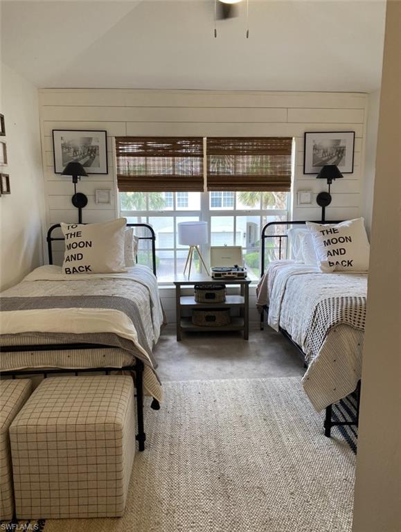 768 Hampton Circle, Unit 188 Naples, FL 34105 - Photo 5 of 11 a bedroom with a bed and a night stand