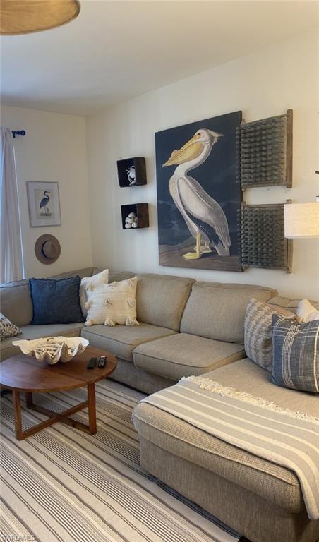 768 Hampton Circle, Unit 188 Naples, FL 34105 - Photo 7 of 11 a living room with furniture and a couch