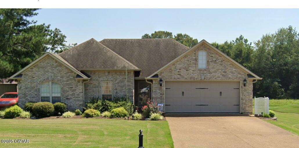5111 Rolling Meadow Milan, TN 38358 - Photo 1 of 36 a view of a house with a yard