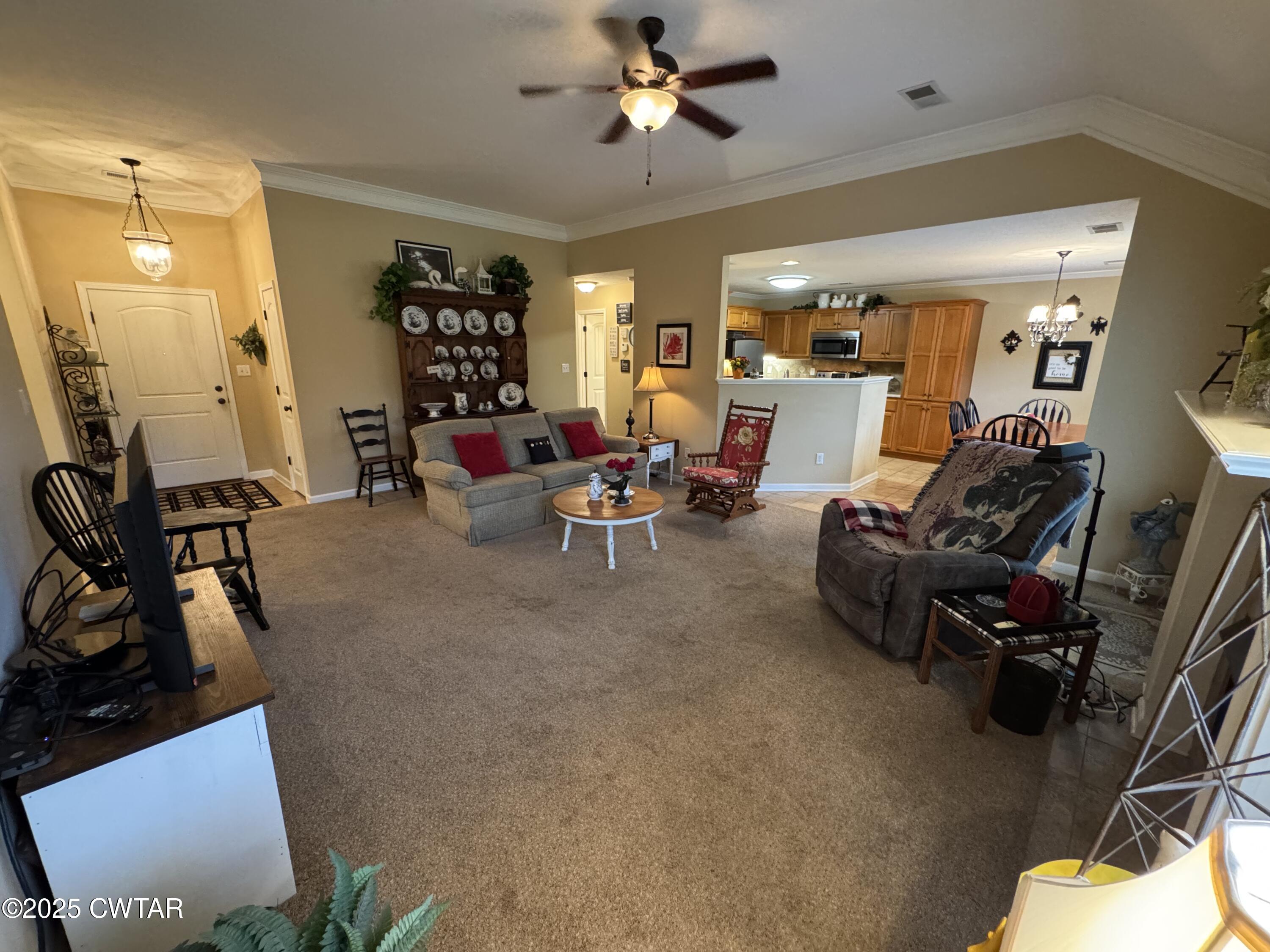 5111 Rolling Meadow Milan, TN 38358 - Photo 12 of 36 a living room with furniture and a flat screen tv
