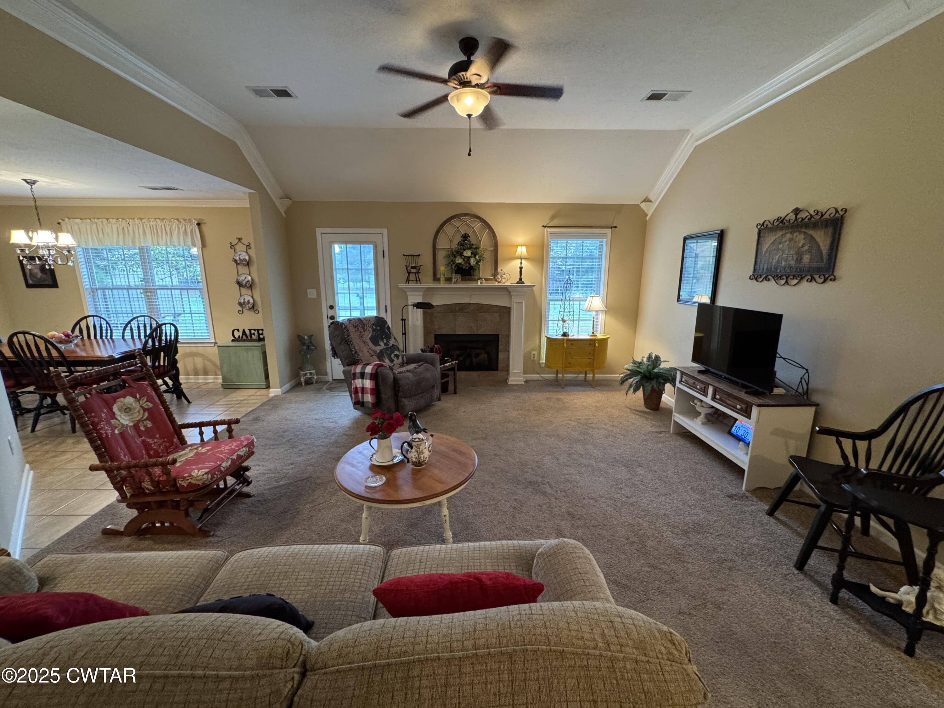 5111 Rolling Meadow Milan, TN 38358 - Photo 13 of 36 a living room with furniture a fireplace and a flat screen tv