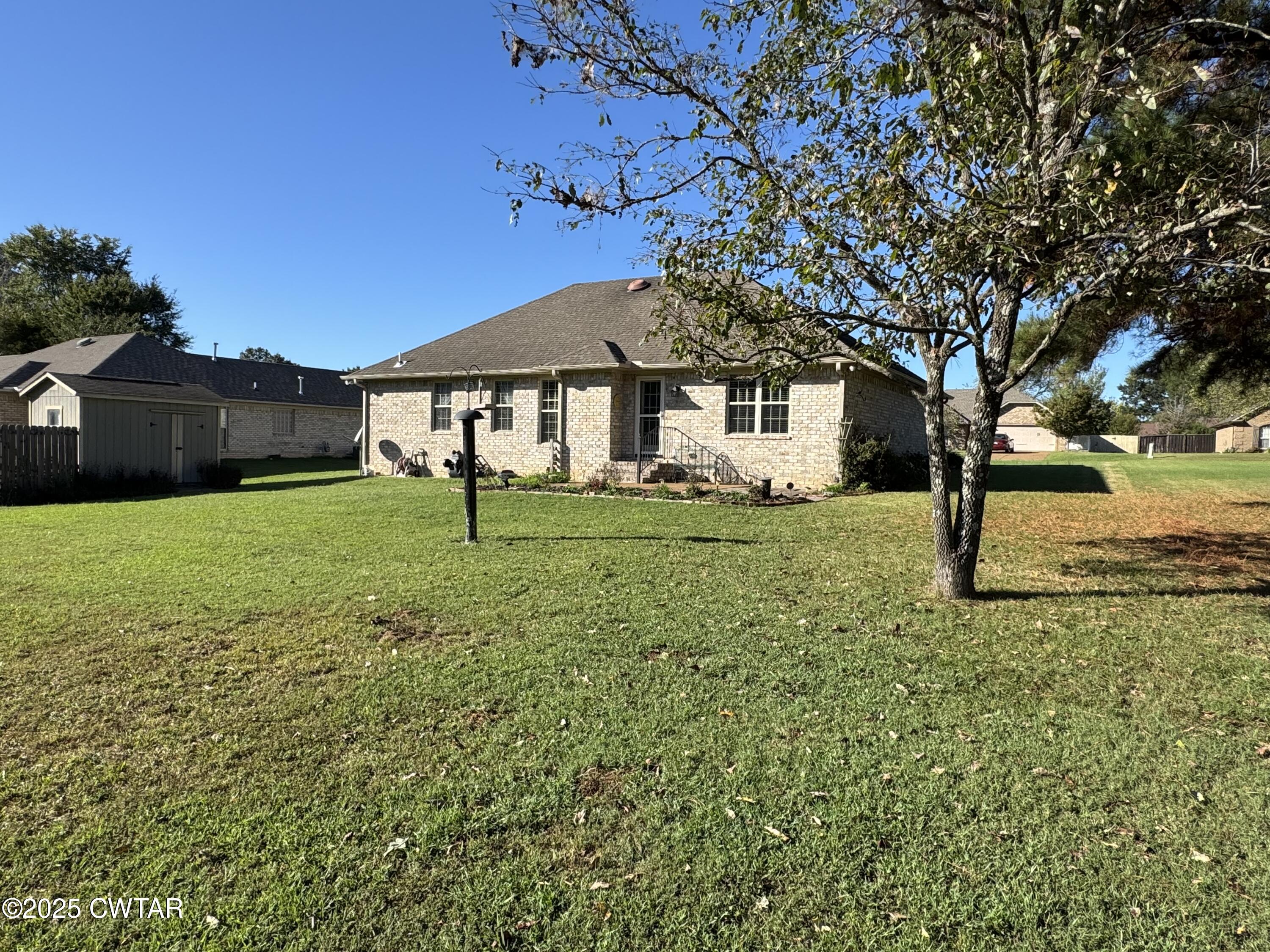 5111 Rolling Meadow Milan, TN 38358 - Photo 28 of 36 a front view of a house with garden